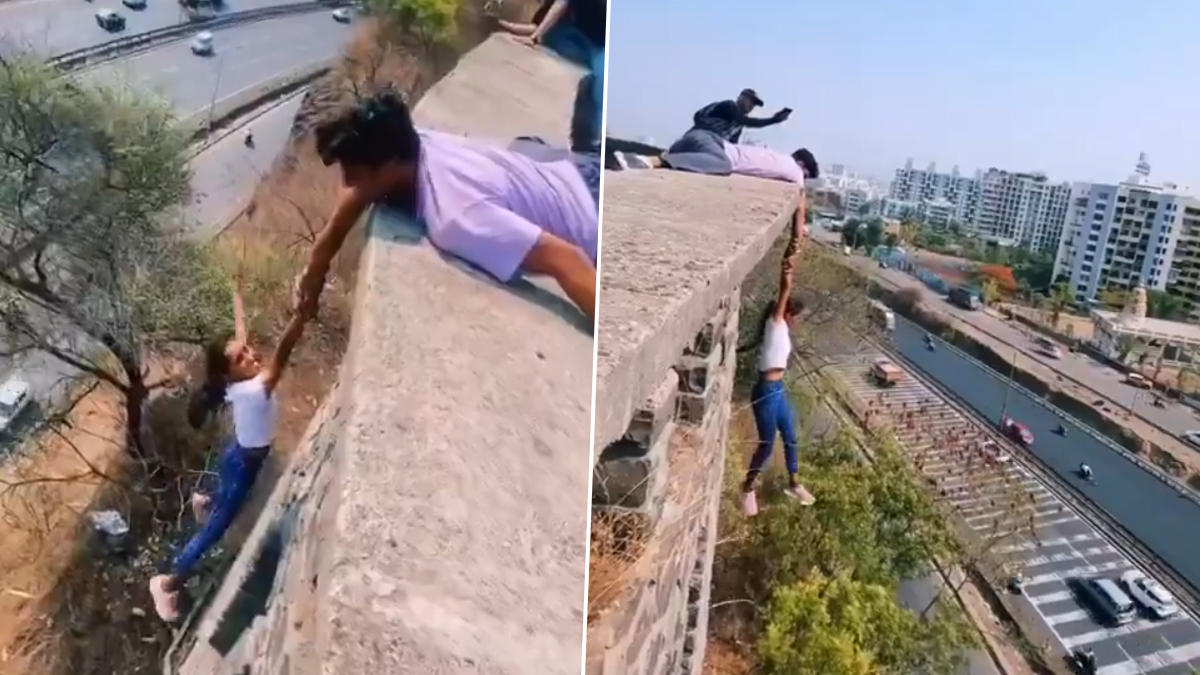 Youngsters Dangerous Stunt Video: రీల్స్ పిచ్చి ఎంత ముదిరిందో వీడియోలో చూడండి, పాడుబడిన భవనంపై నుండి వేలాడుతూ స్టంట్